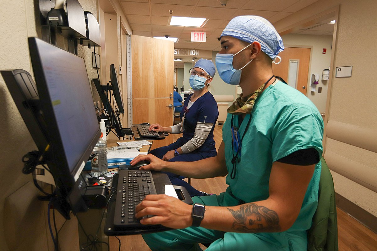 Healthcare professional looking at computer