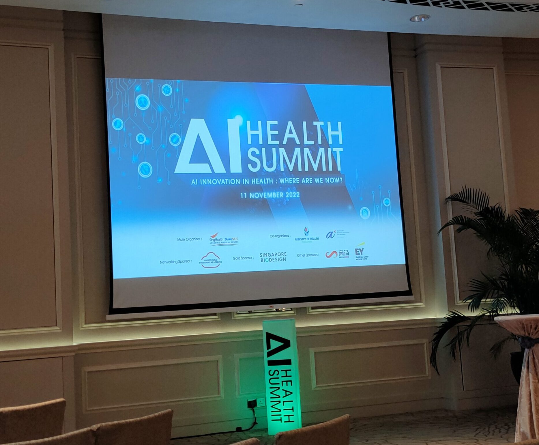 Backdrop of AI Health Summit in Fullerton Hotel Ballroom