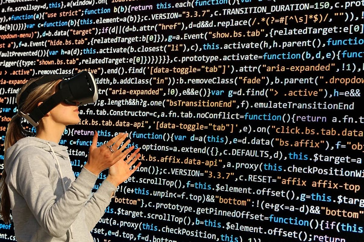 Lady using VR headset to look at coding